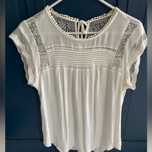 White blouse Daniel rainn